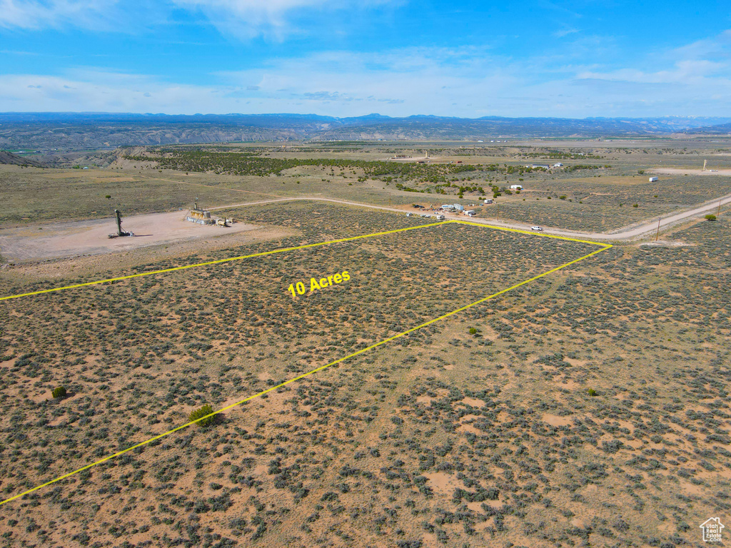 Birds eye view of property featuring a mountain view and a rural view
