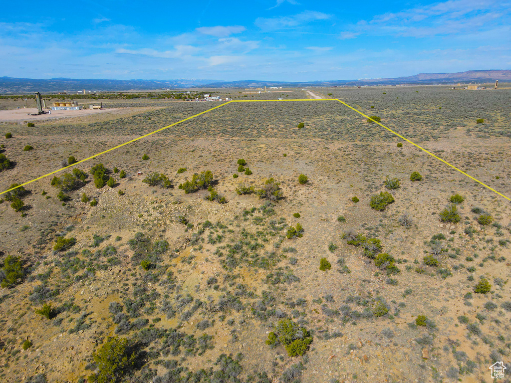 Aerial view featuring a desert view, a mountain view, and a rural view