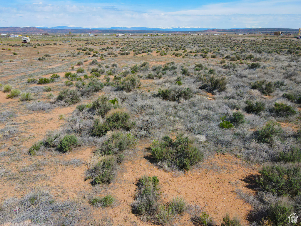 View of rural area featuring a desert landscape and mountains