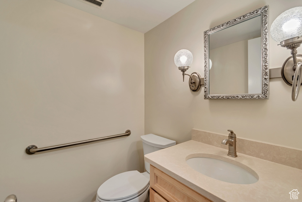 Bathroom featuring toilet and vanity