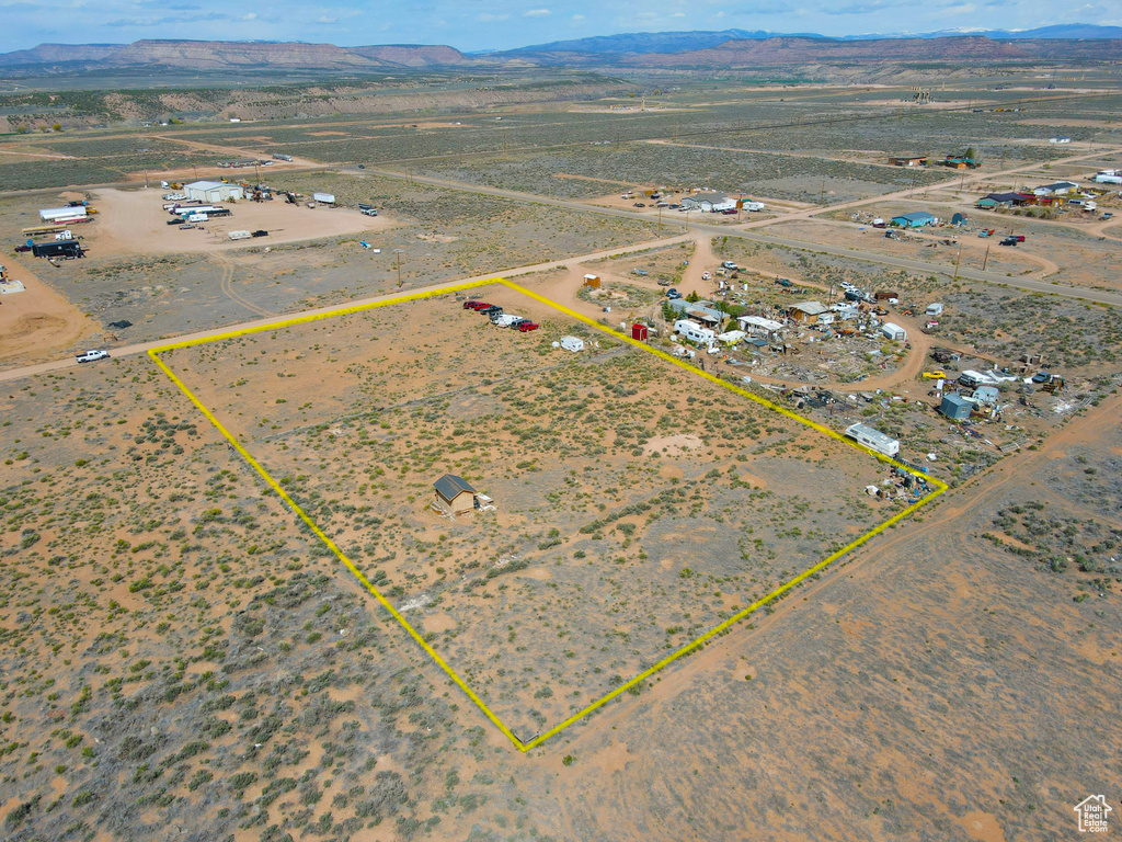 View of rural area featuring mountains, property parcel outlined, and a desert landscape