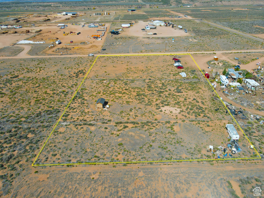 Aerial view of sparsely populated area with property parcel outlined