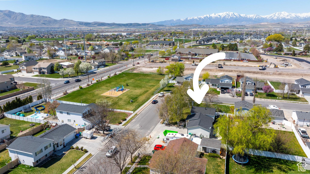 Birds eye view of property featuring a mountain view and a residential view