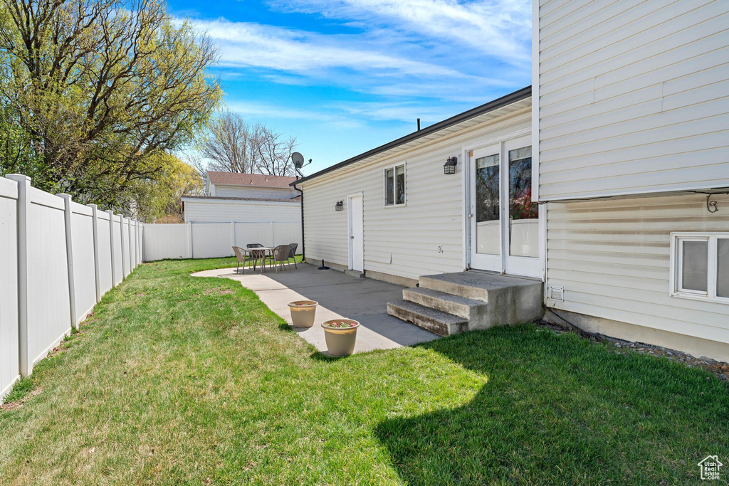 View of yard with a patio area and fence private yard