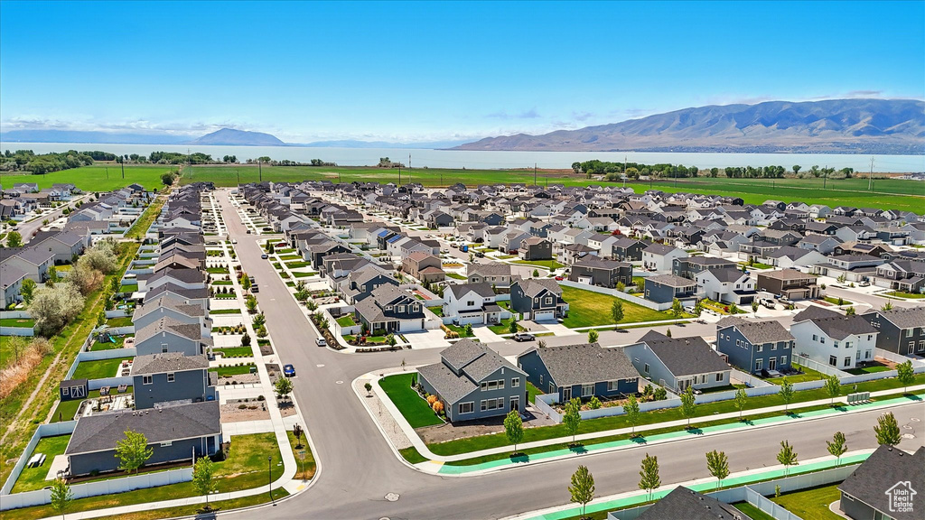 Aerial perspective of suburban area featuring a water and mountain view