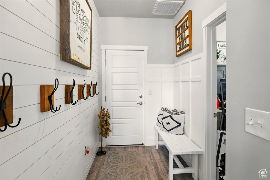 Mudroom with dark wood finished floors