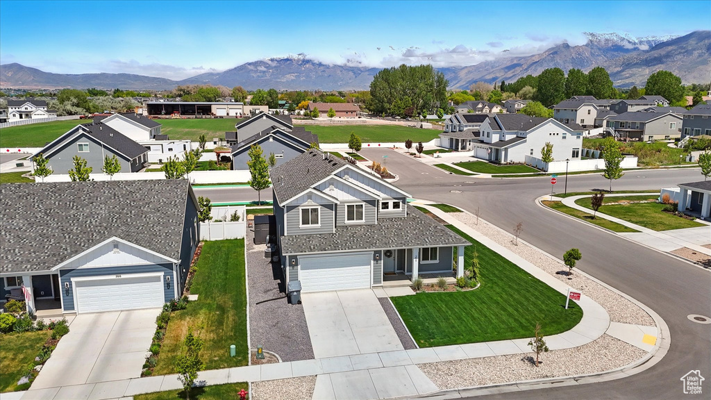 Aerial perspective of suburban area featuring a mountain backdrop