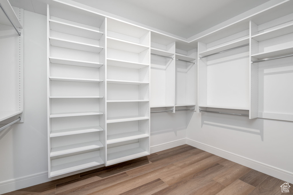 Spacious closet with wood finished floors
