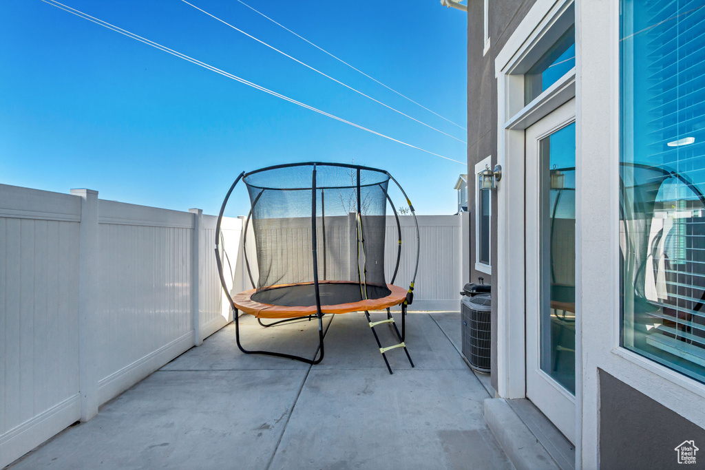 Balcony featuring central AC and a patio