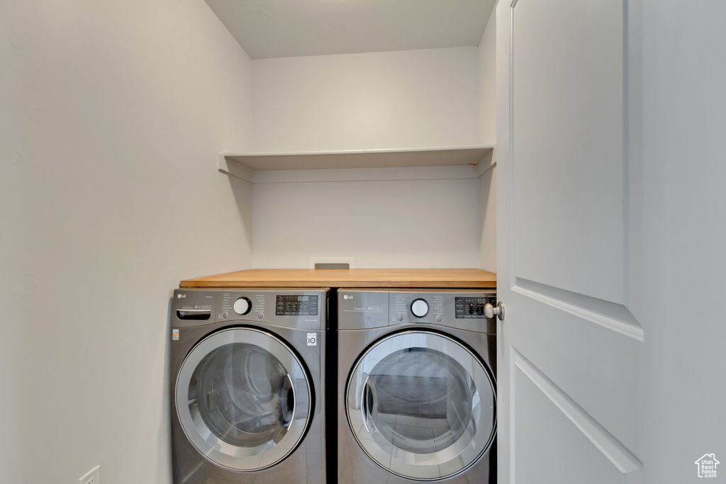 Clothes washing area with washer and clothes dryer and laundry area