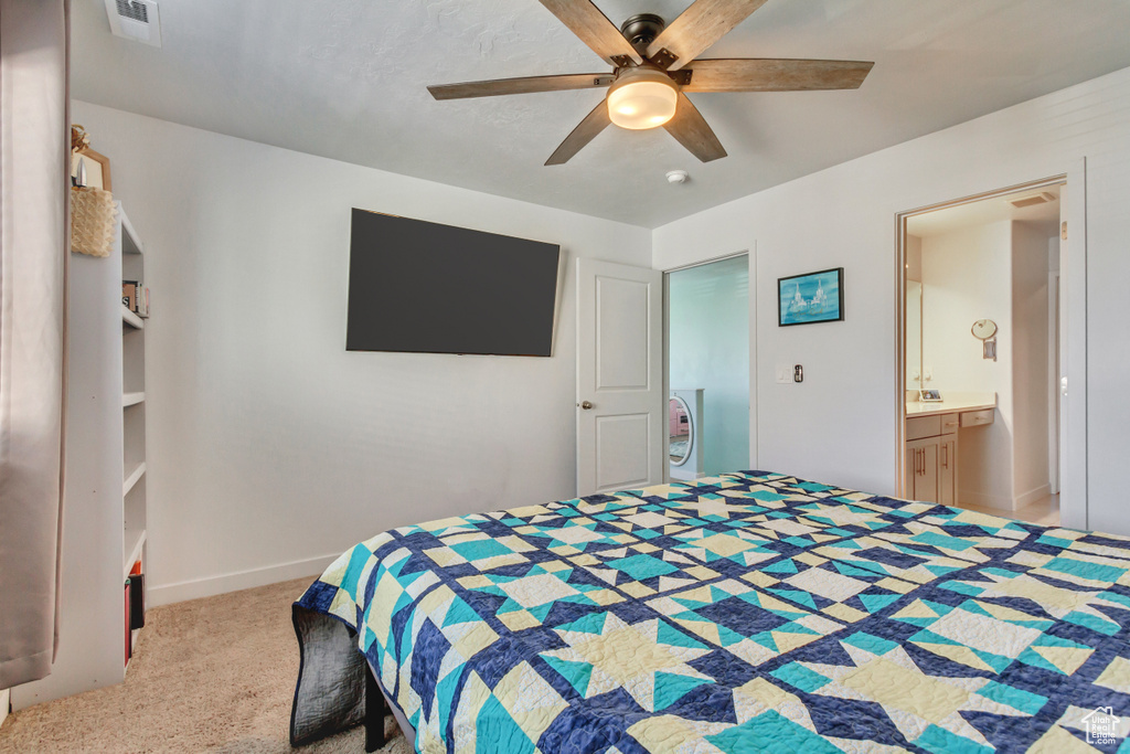 Carpeted bedroom with visible vents, baseboards, and a ceiling fan