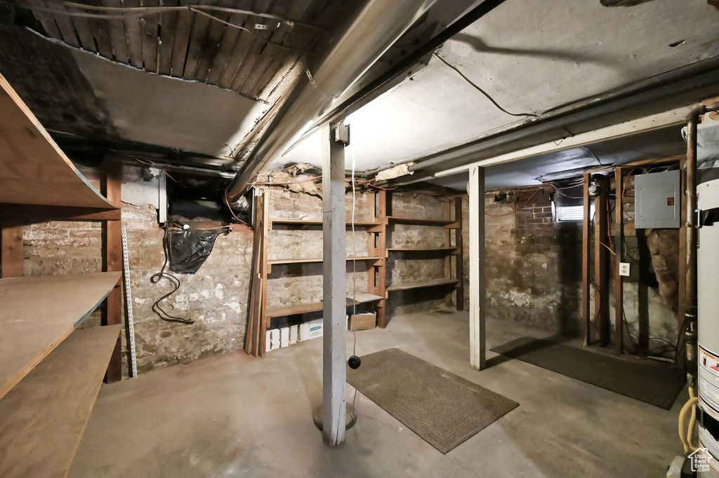 Unfinished basement with electric panel