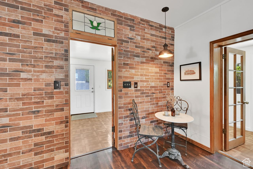 Dining area with parquet floors and baseboards