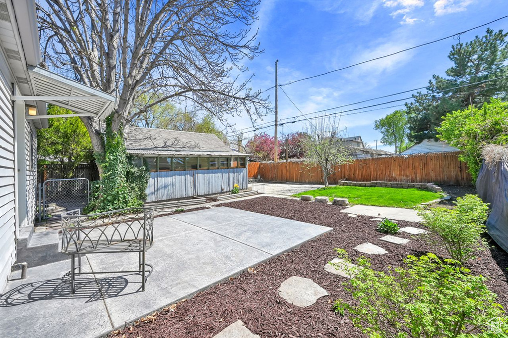 View of yard with a patio and a fenced backyard