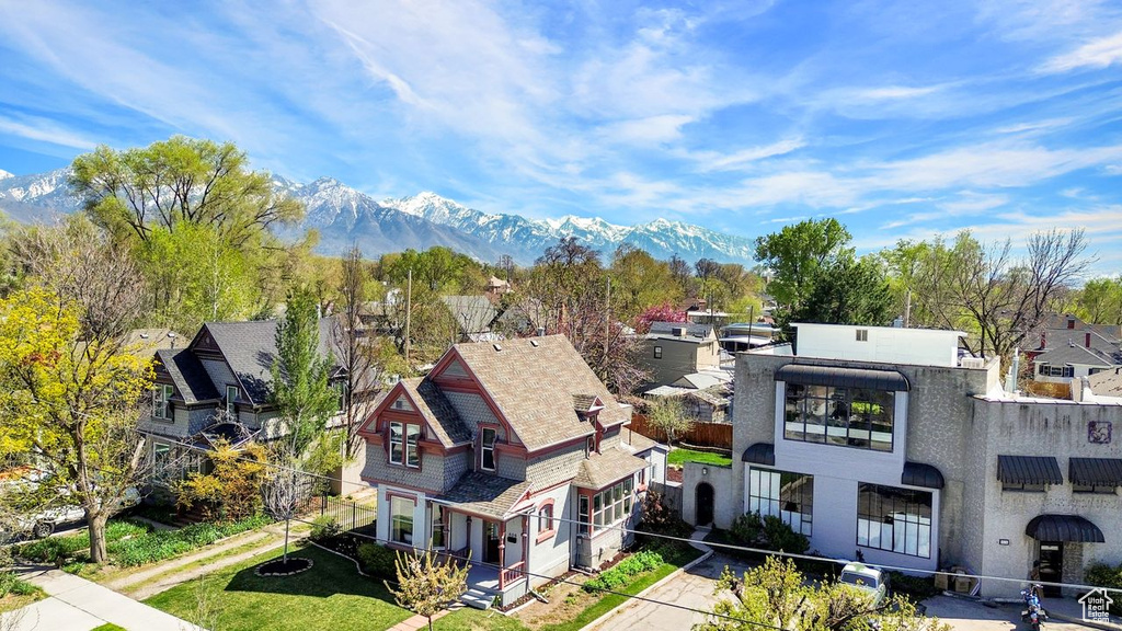 Drone / aerial view with a residential view and a mountain view