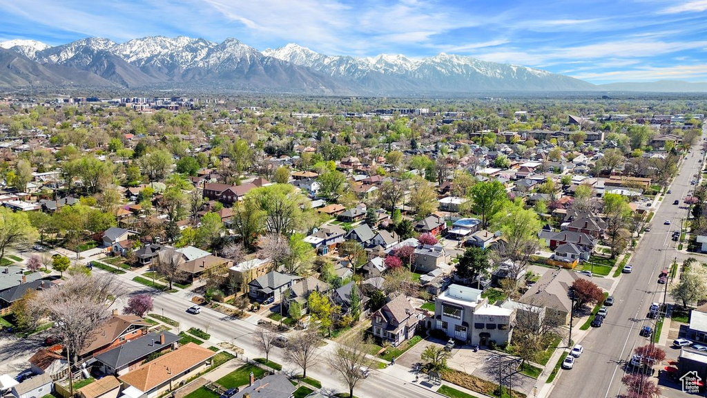Birds eye view of property with a residential view and a mountain view