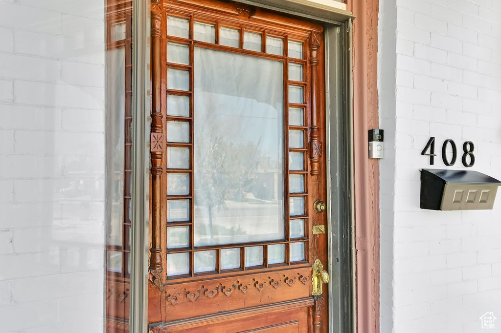 Doorway to property featuring concrete block siding