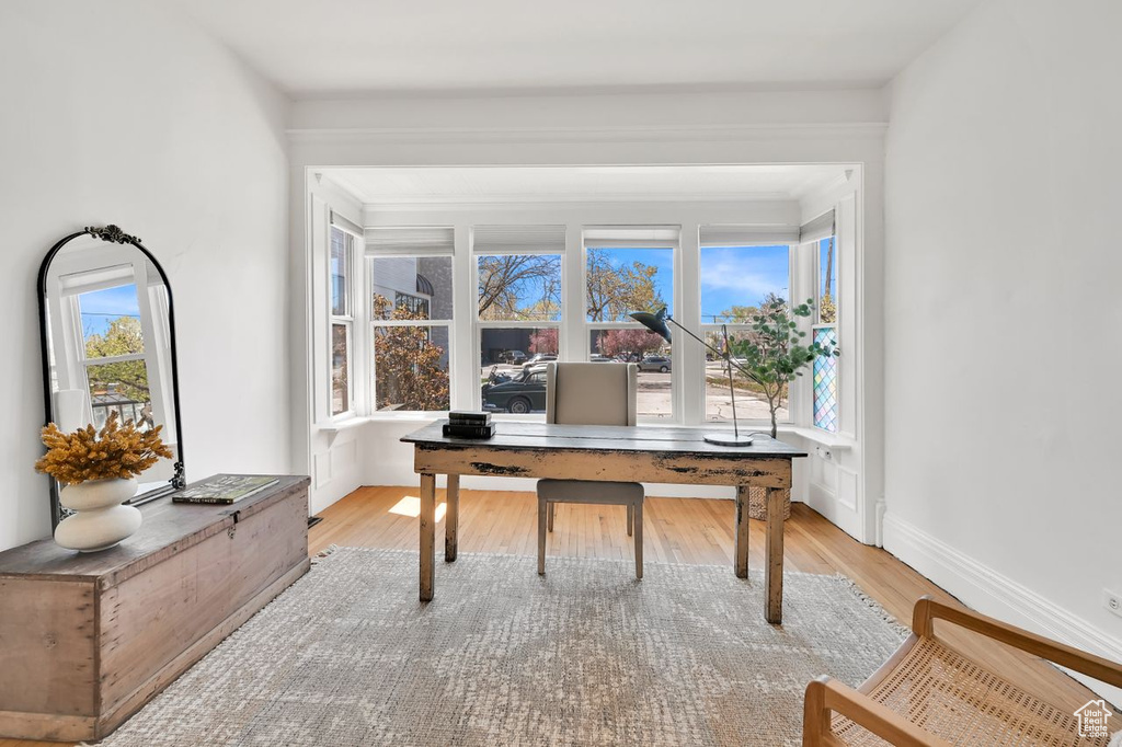 Office space with light wood finished floors and baseboards