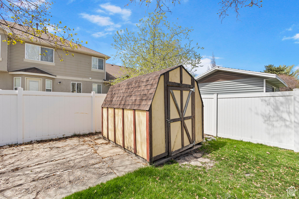 View of shed featuring a fenced backyard