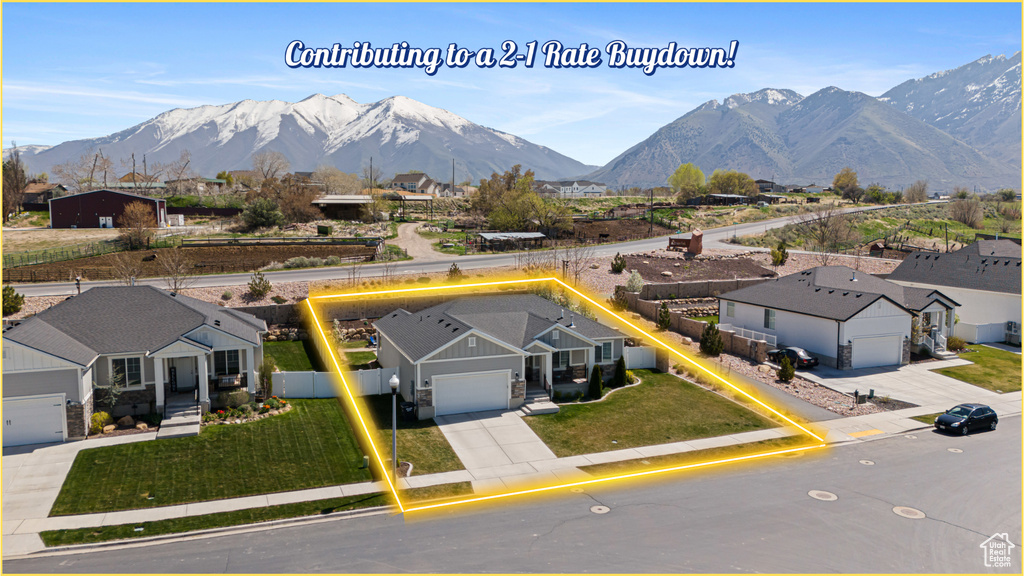 Aerial perspective of suburban area with a mountainous background