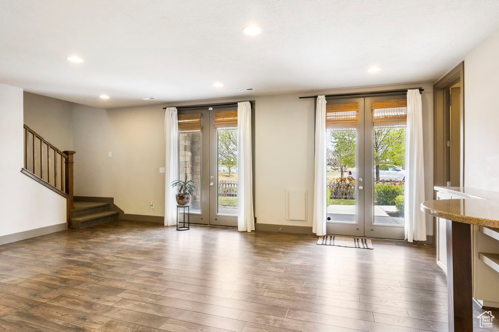 Doorway to outside featuring hardwood / wood-style floors, french doors, recessed lighting, and a wealth of natural light