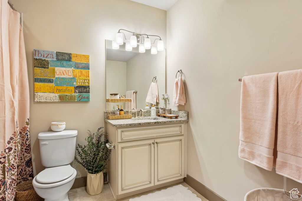 Bathroom featuring vanity and toilet