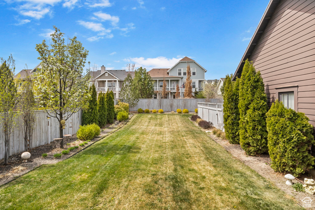 View of yard with a fenced backyard
