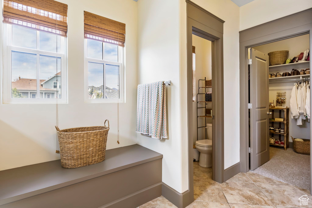 Bathroom with toilet and baseboards