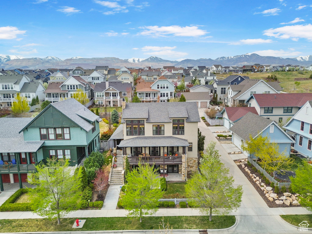 Birds eye view of property with a mountain view and a residential view