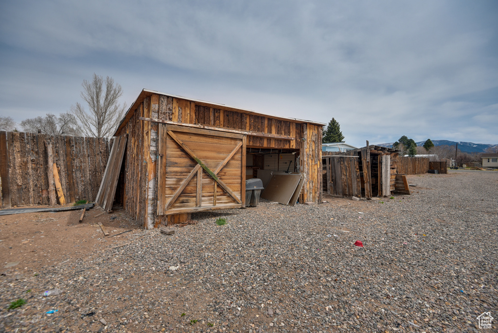 View of outdoor structure featuring an outbuilding