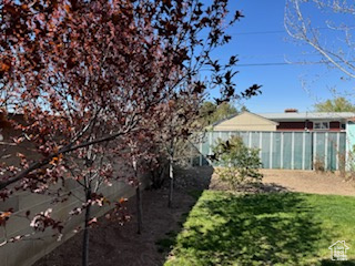 View of yard featuring fence