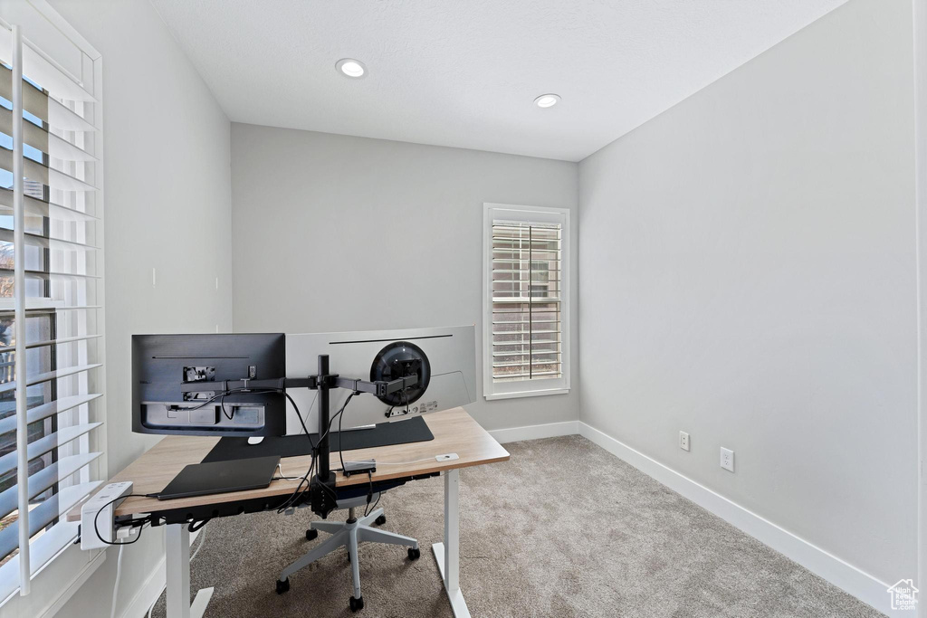 Carpeted home office featuring recessed lighting and baseboards