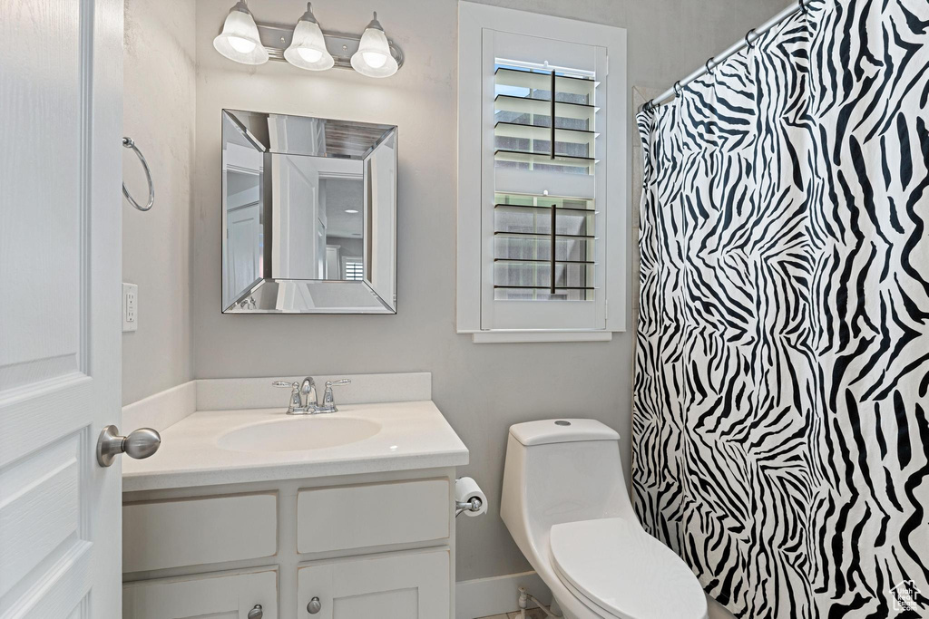 Bathroom featuring toilet and vanity
