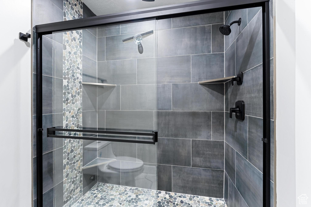 Full bathroom with a shower stall