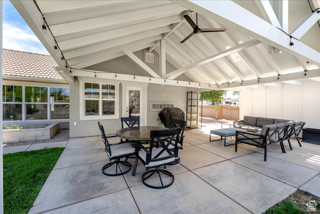 View of patio / terrace with outdoor dining space, an outdoor living space, a gazebo, and fence