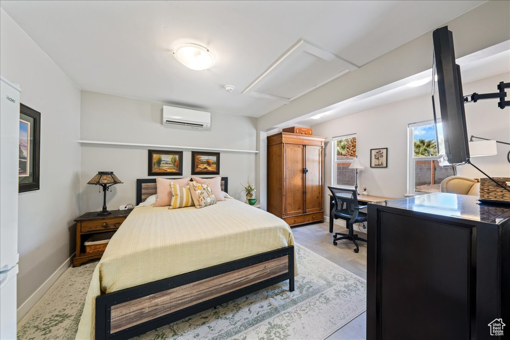 Bedroom with an AC wall unit