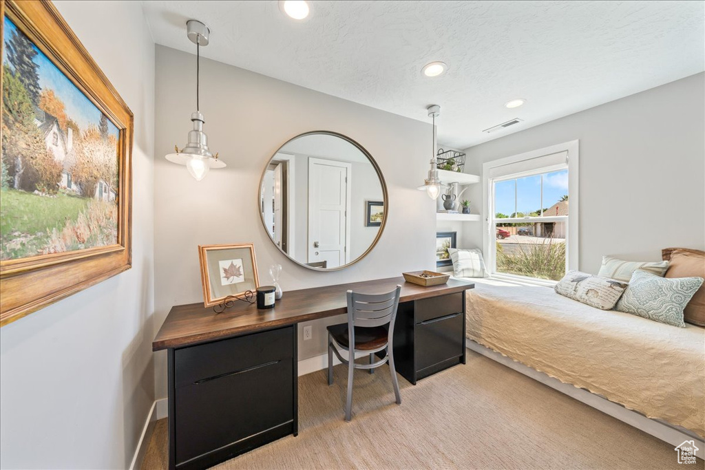Bedroom featuring a glass covered fireplace, recessed lighting, visible vents, and baseboards