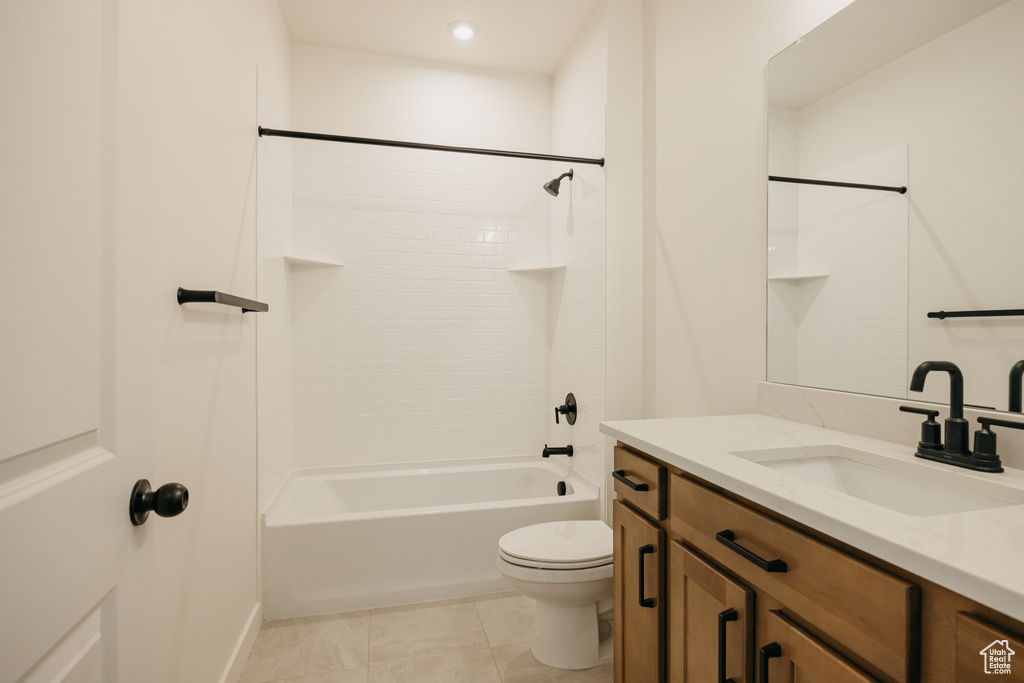 Bathroom with toilet, vanity, bathing tub / shower combination, and recessed lighting