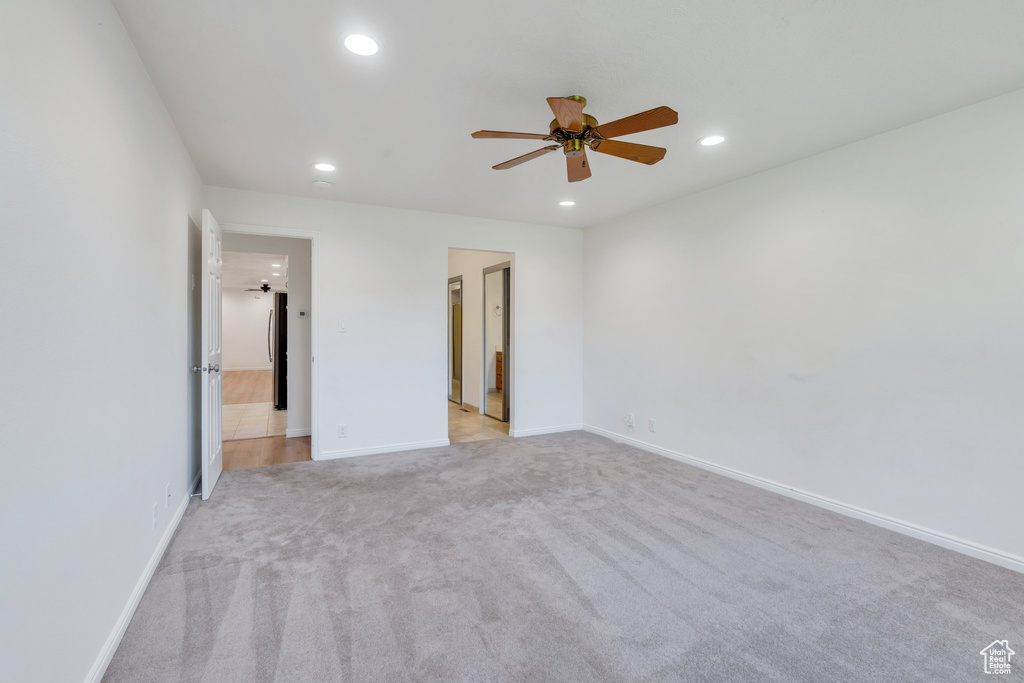 Unfurnished bedroom featuring recessed lighting and light carpet