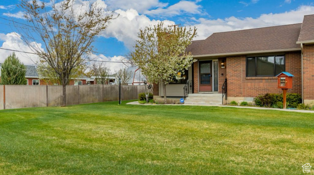 View of yard with fence