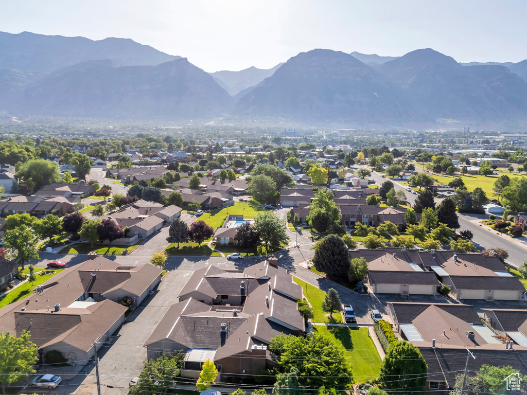 Aerial perspective of suburban area featuring a mountain backdrop