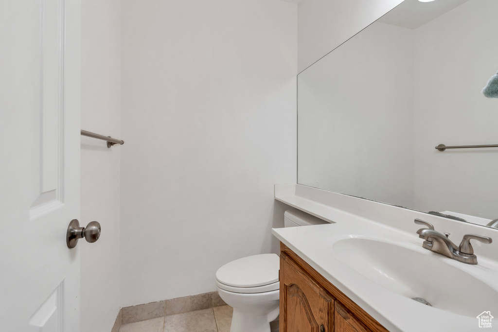 Bathroom with vanity and tile patterned floors