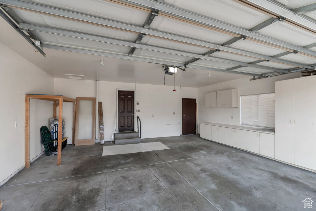 Garage featuring a garage door opener