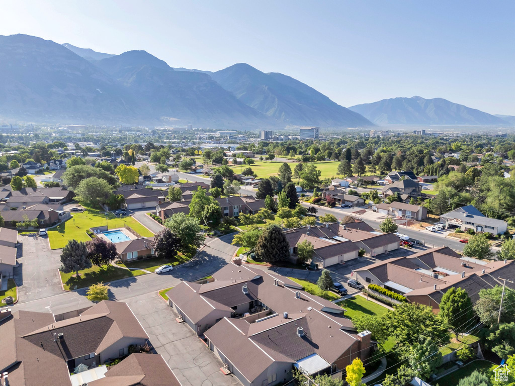 Aerial perspective of suburban area with a mountainous background