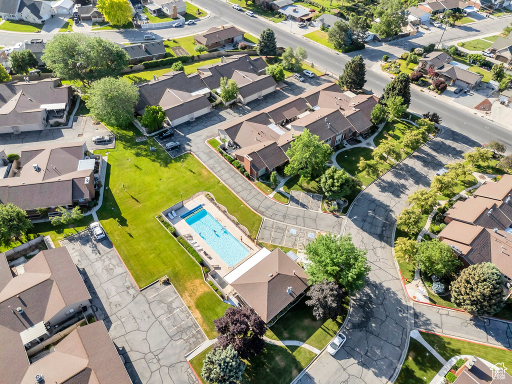 Aerial perspective of suburban area featuring a pool area