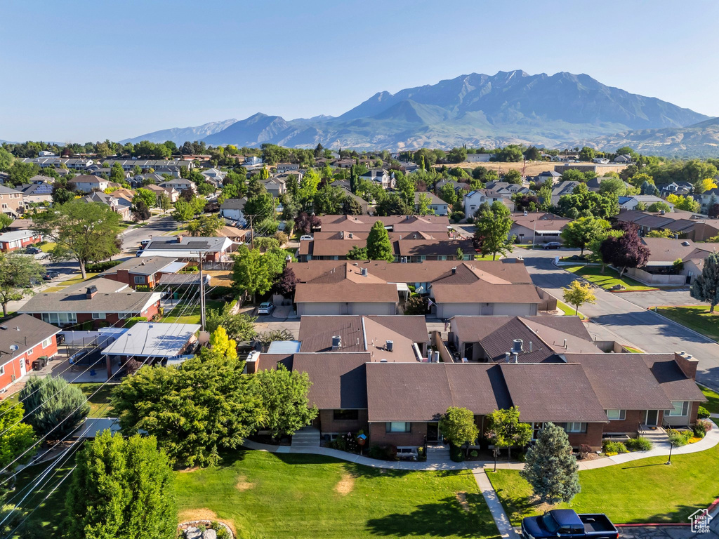 Aerial perspective of suburban area with a mountainous background