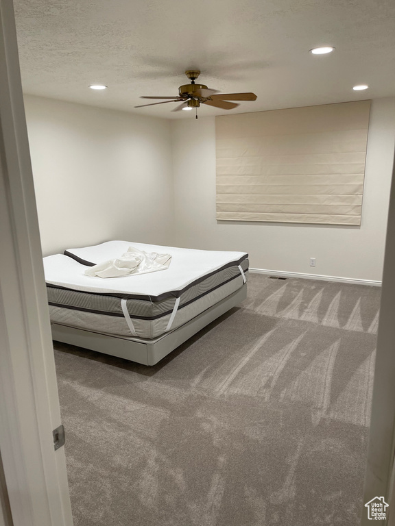 Bedroom with recessed lighting, carpet, baseboards, and a ceiling fan