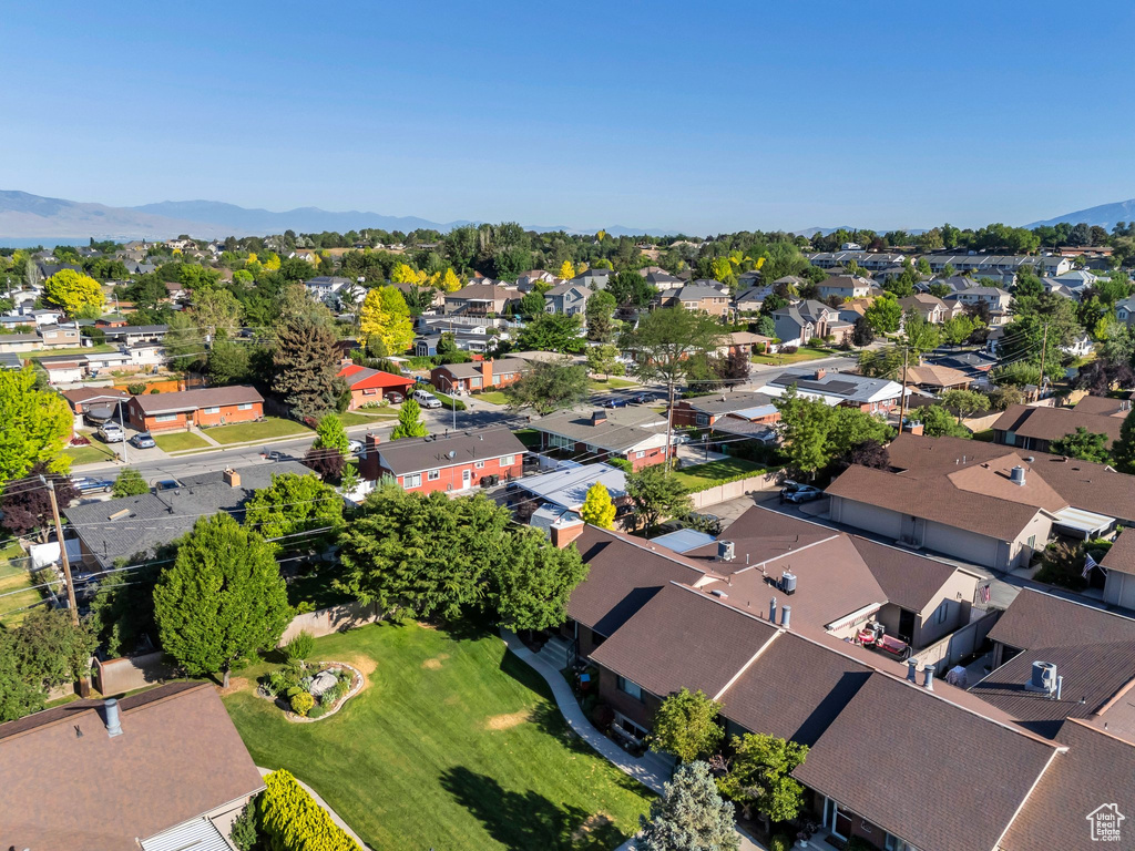 Aerial view of residential area featuring mountains
