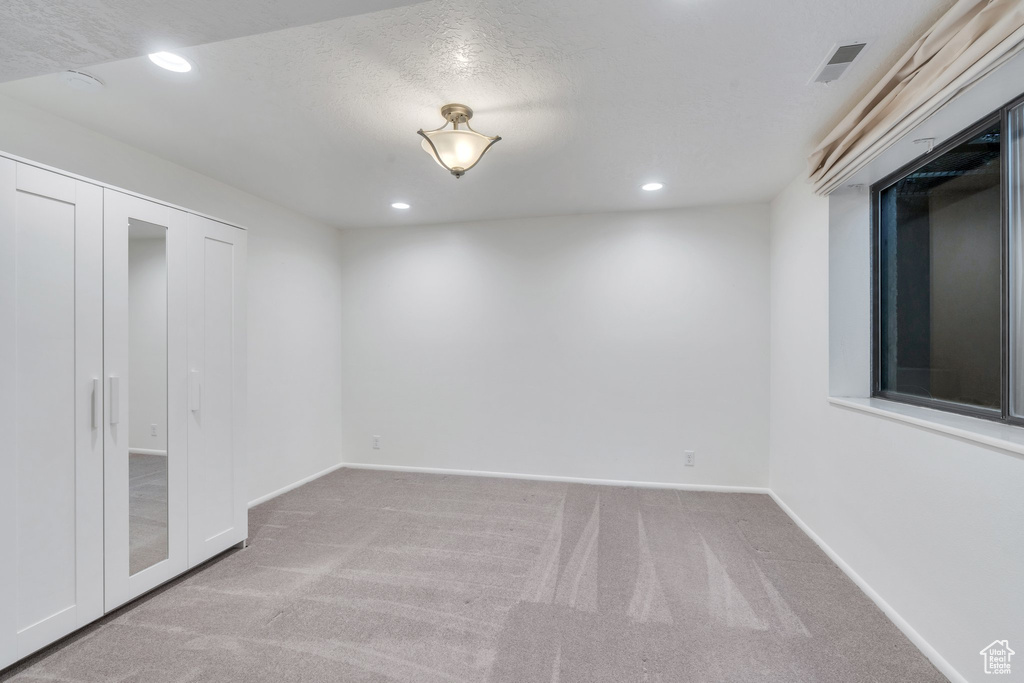 Basement featuring carpet floors and recessed lighting