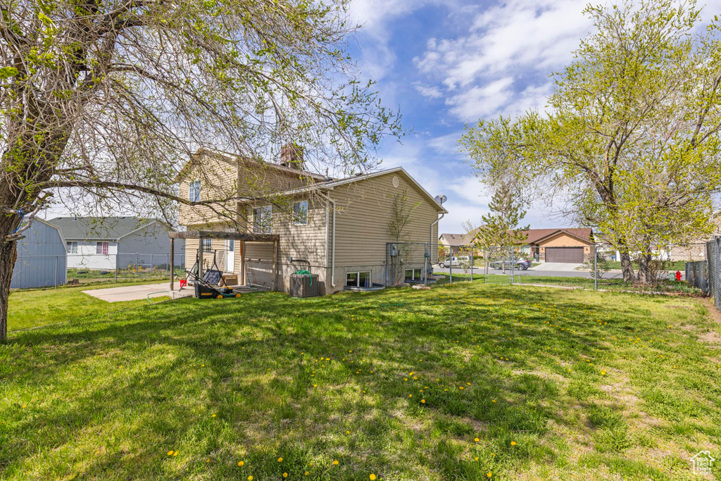 View of yard featuring a patio and fence